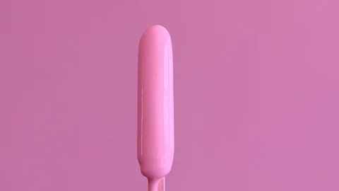 Pink raspberry ice lolly melting and spinning on turntable Stock Footage 94827265