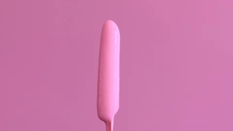 Pink raspberry ice lolly spinning around and melting Stock Footage 94827400
