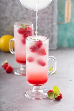Pink raspberry lemonade in tall glasses Stock Photos
