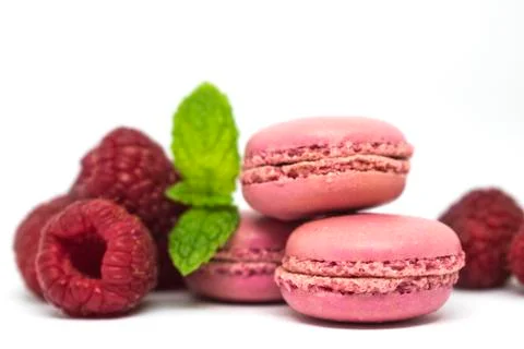 Pink raspberry macaroons, mint on white background Stock Photos