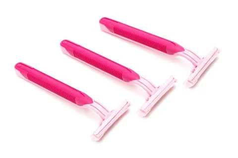 Pink razor on white background Stock Photos