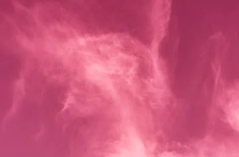 Pink red sky with cobweb clouds, bright, colorful background close-up, outdoo Stock Photos