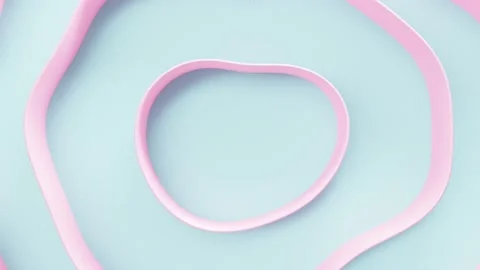 Pink ribbon change shape frame on blue background. minimal idea concept. Video stock 196078940