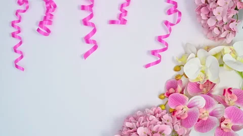 Pink ribbons move on white theme with romantic flowers. Stop motion Stock-Footage 166768789