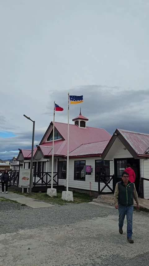 Pink-Roofed Border Post with Flags, Patagonia Border Crossing, Chile – Vertical Stock Footage 306491351