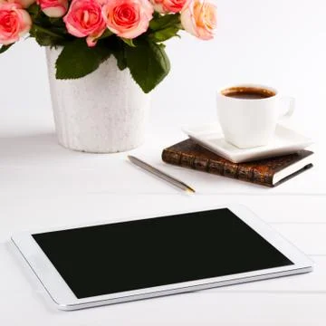 Pink roses,notepad and tablet Stock Photos