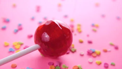 Pink round lollipop close-up on pink background. Stock Footage 85896503