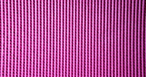 Pink rubber mat with parallel lines background closeup 4k movie slow motion Stock Footage 238531975
