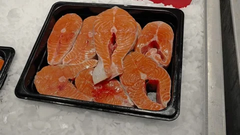Pink salmon fillets in plastic tray looking fresh and neatly arranged Stock Footage 312460327