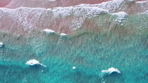 Pink sand and Turquoise waves on a tropical paradise beach. Видео 332304494