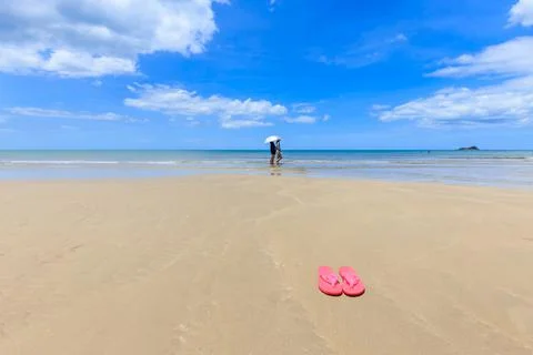Pink sandals on the beautiful beach Foto stock
