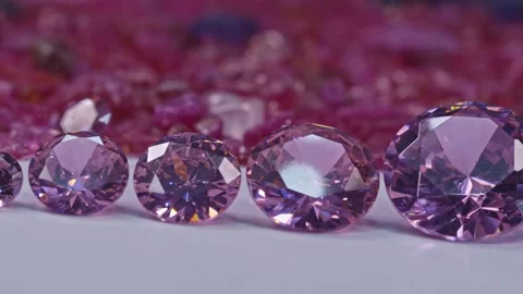 Pink sapphires diamonds in different size on white ground Stock Footage 243175853