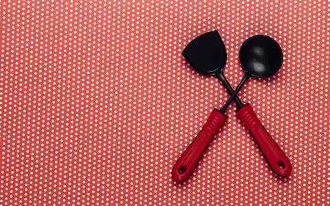 Pink scissors on textured orange background Stock Photos
