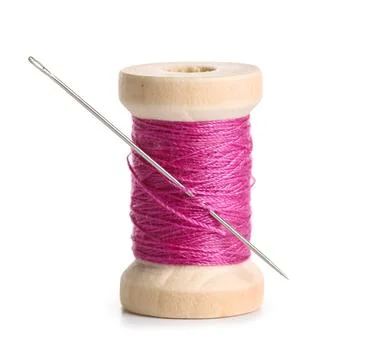 Pink sewing thread with needle on white background Stock Photos