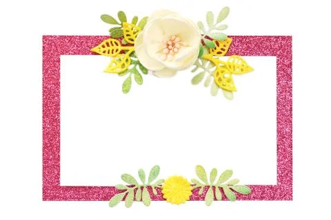 Pink shiny rectangular frame with handmade artificial flowers and petals. iso Stock Photos