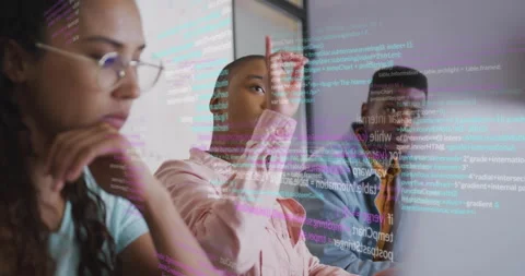 Pink-shirted colleague pointing at floating code overlay and tracing syntax Stock Footage 314348729