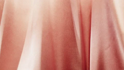 Pink silk close-up, orange satin luxury cloth texture background. Luxurious Stock Footage 168557905