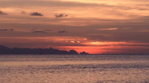 Pink Sky with Clouds at Dusk above the Sea Stock Footage 74583983