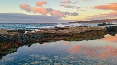 Pink Sky With Clouds Reflection In The Water Stock Photos