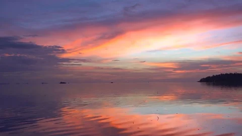 Pink Sky at Dusk with Calm Sea View Stock Footage