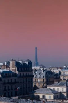 A pink sky with the eiffel tower on top Stock Photos