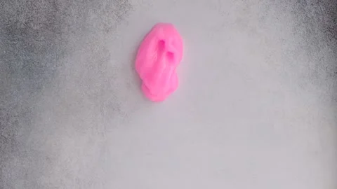 Pink slime flows down a concrete wall Stock Footage 131608151