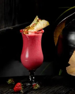 Pink smoothie with slice of pineapple Stock Photos
