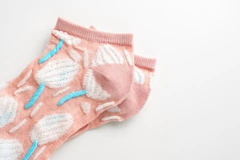 Pink socks with pattern on white background Stock Photos