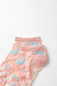 Pink socks with pattern on white background Stock Photos