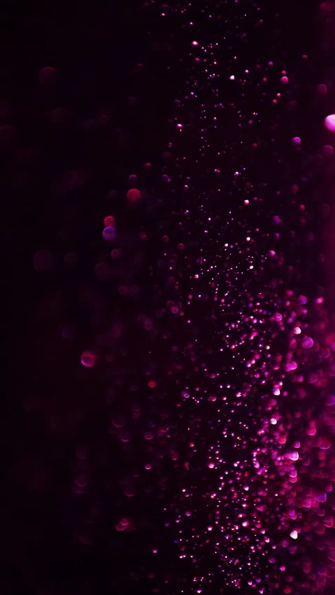 Pink sparkle particles with bokeh effect, abstract background. Vertical video. Stock Footage 270212395