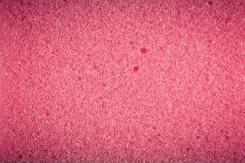 Pink sponge made of microfiber material. Texture, background. In Increase Stock Photos