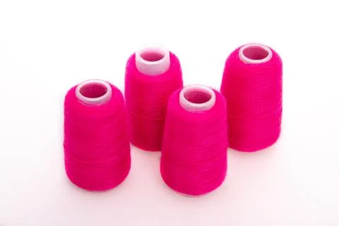 Pink spool of thread isolated on white background. Skein of woolen threads. Yarn Stock Photos