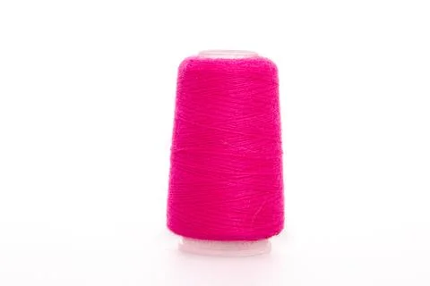 Pink spool of thread isolated on white background. Skein of woolen threads. Yarn Stock Photos