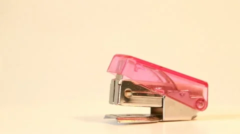 Pink stapler rotating Stock Footage 21263596