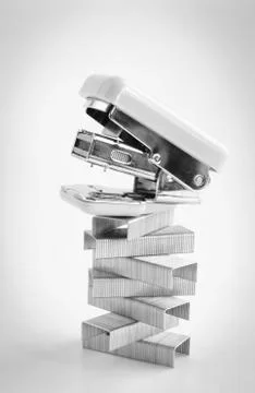 Pink stapler with staples stack Photos