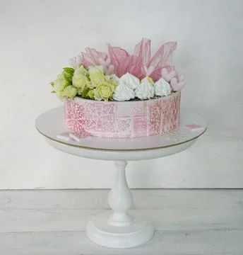 Pink stencil cake with roses and merengue for anniversary Stock Photos