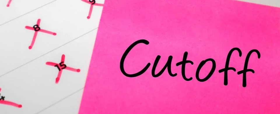 Pink sticky note with Cutoff text placed over a paper calendar with specifi.. Stock Photos