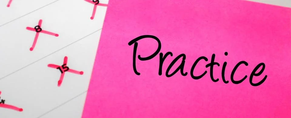 Pink sticky note with Practice text on a calendar with red marked dates. Co.. Stock Photos