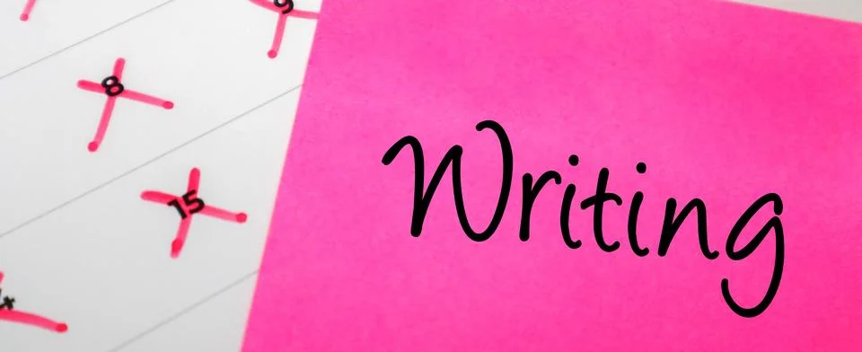Pink sticky note with Writing text on a calendar with red marked dates. Con.. Stock Photos