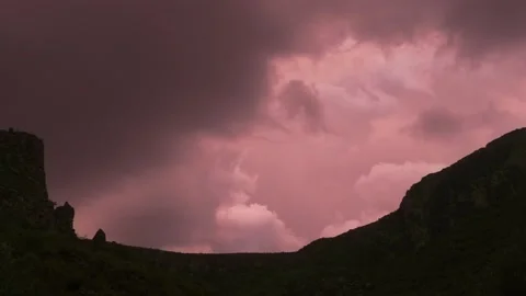 Pink stormy sunset sky over a mountain. Stock Footage 217414983