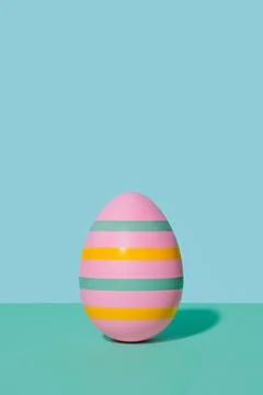 Pink striped Easter egg in 80s-90s retro style. Stock Photos