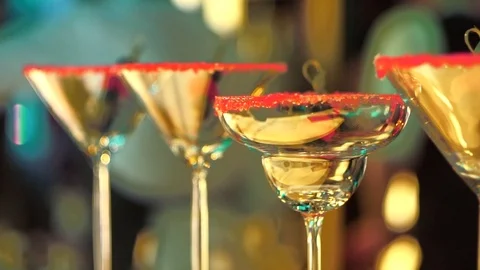 Pink sugar on empty Martini and Margarita glasses on a party night at fancy bar Stockbeeldmateriaal 116719013