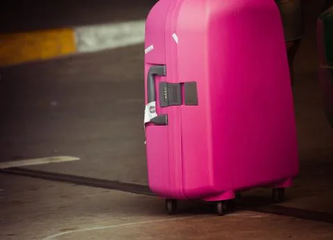 Pink suitcase Stock Photos