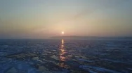 Pink Sunrise. Winter Landscape By The River Covered With Ice Stock Footage