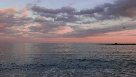 Pink sunset above blue waves of Mediterranean sea in Barcelona Stock Footage 300217062