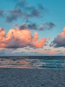 Pink sunset on the beach Stock Photos