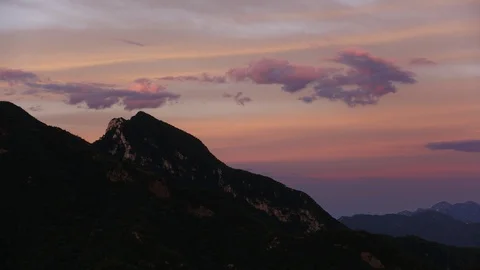 Pink sunset behind the ridge of mountains near Beijing Stock Footage 124997429