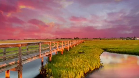 Pink Sunset Clouds on the Bay with Foot Bridge - Loopable Stock Footage 201757010