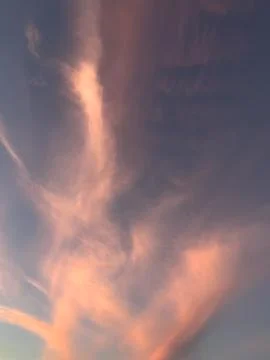 Pink Sunset Clouds in Blue Sky Stock Photos