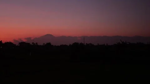 Pink Sunset With Evening Clouds Above Hills. Time-Lapse of Dusk in Mountains. Stock Footage 286428302